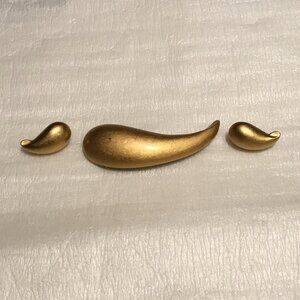 Vintage and very lovely gold tone Trifari brooch and earrings set